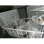 Cage containing a quantity of decanters