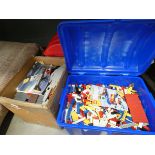 3 boxes containing Lego pieces and Megablocks