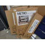 Four boxes containing metro bunk be parts, as found