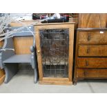 Pine single door cupboard with glazed and leaded door