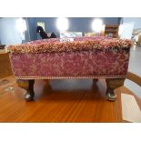 Red floral upholstered footstool