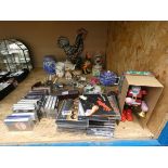 Cage containing tape cassettes, CD's, ornamental figures, loose cutlery and a Father Christmas toy