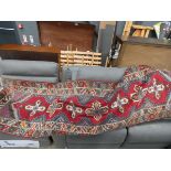 Floral carpet runner with red background