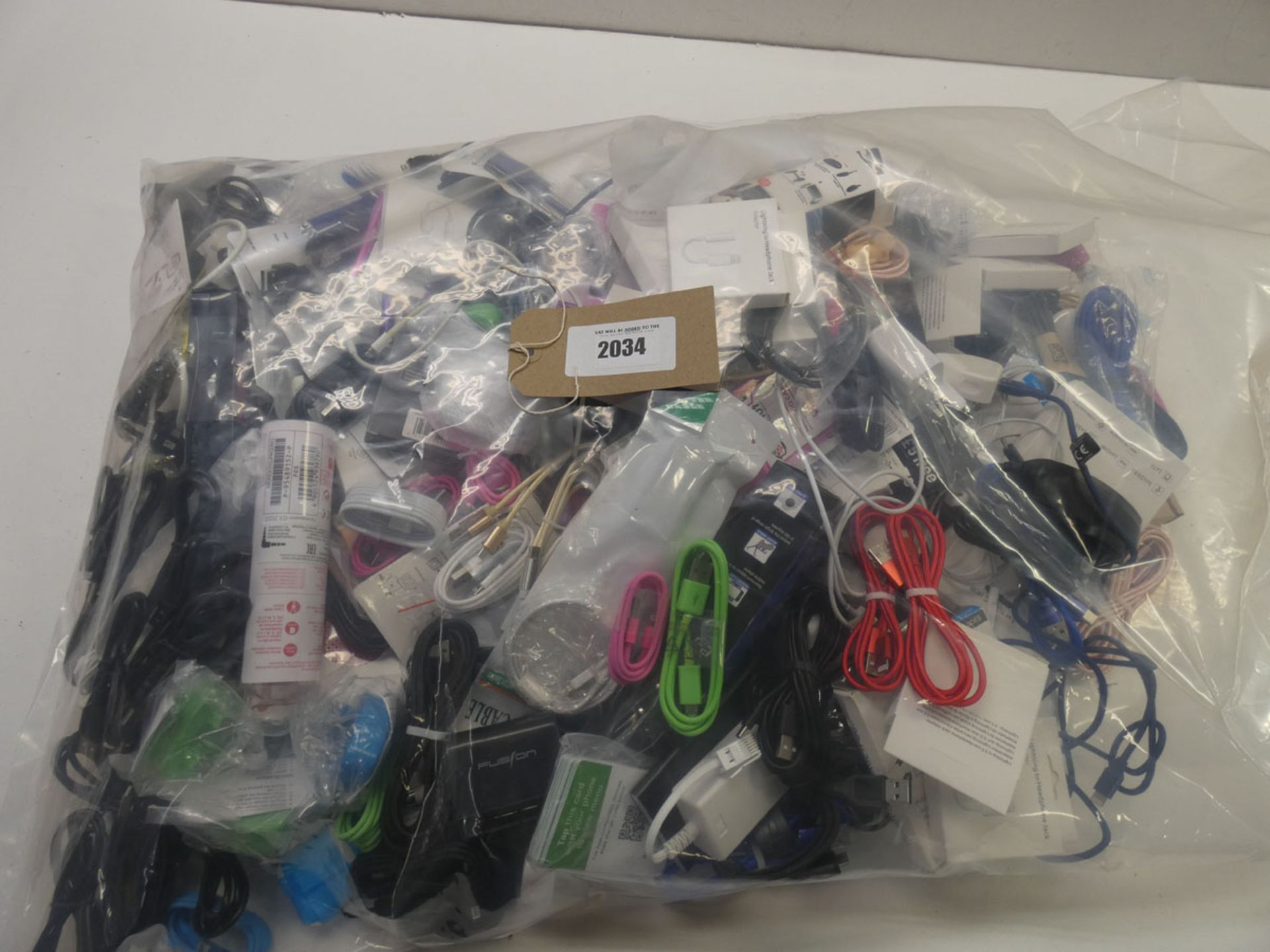 Bag containing quantity of mobile phone accessories; leads, adapters, earphones, etc