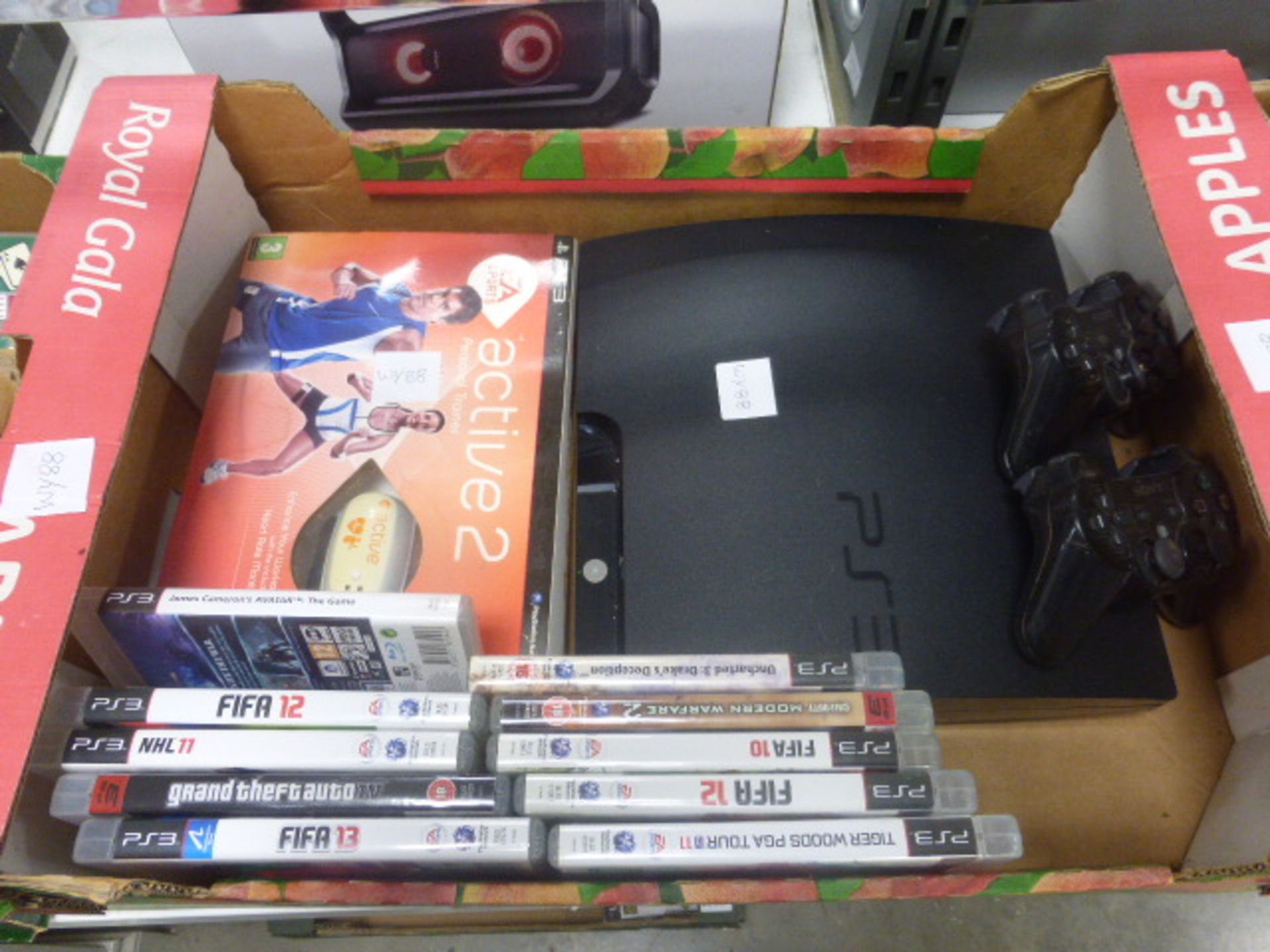 Playstation 3 console with 2 spare controllers and various games including Grand Theft Auto 4