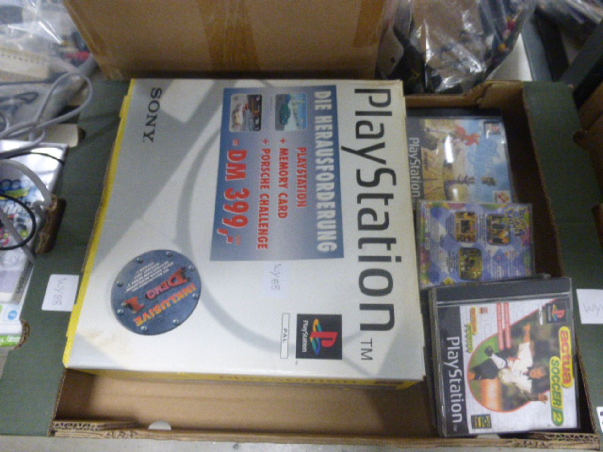 Cardboard tray containing Playstation 1 console, boxed