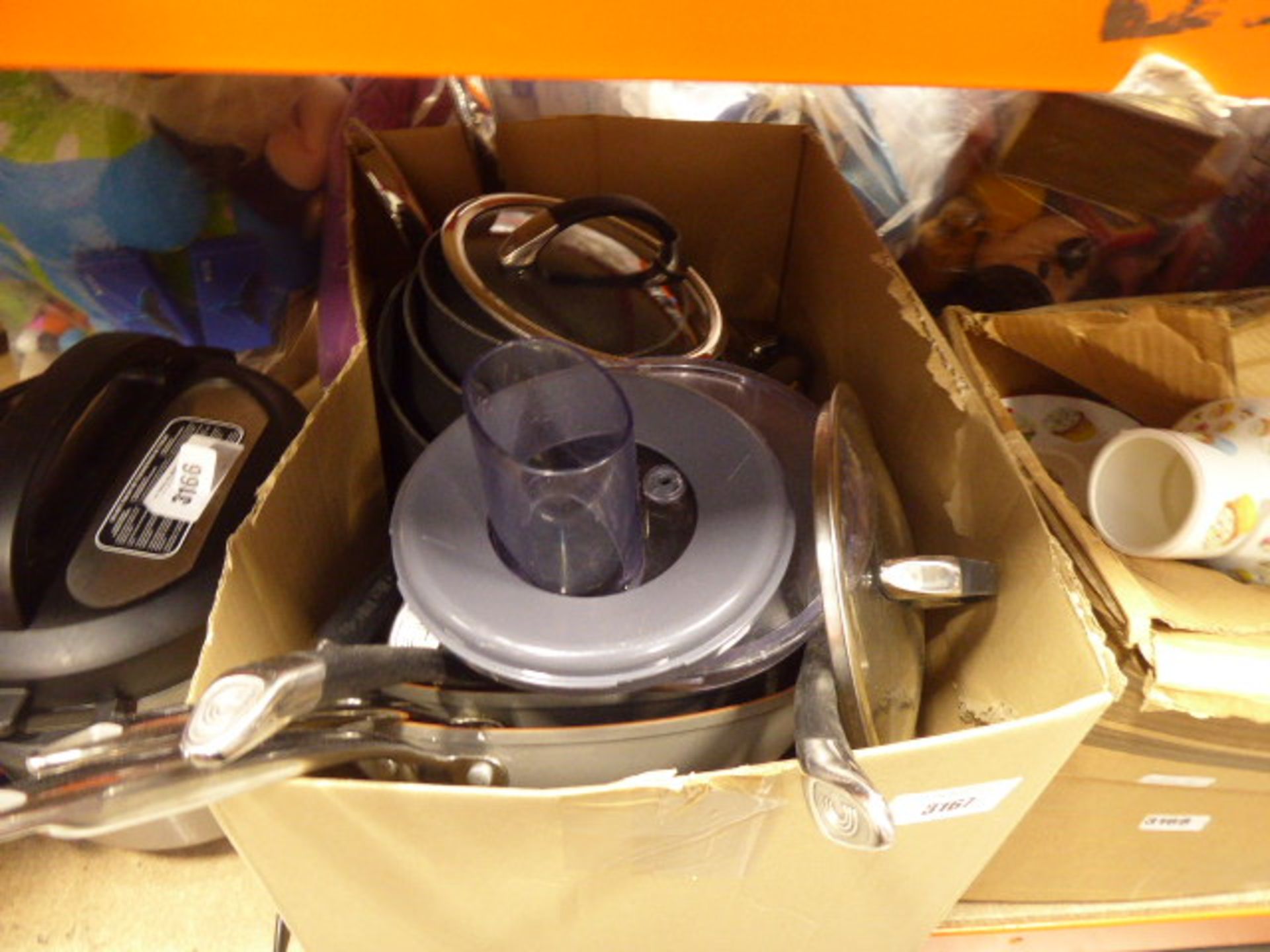 Box containing mixed kitchenware including pans, pots, etc