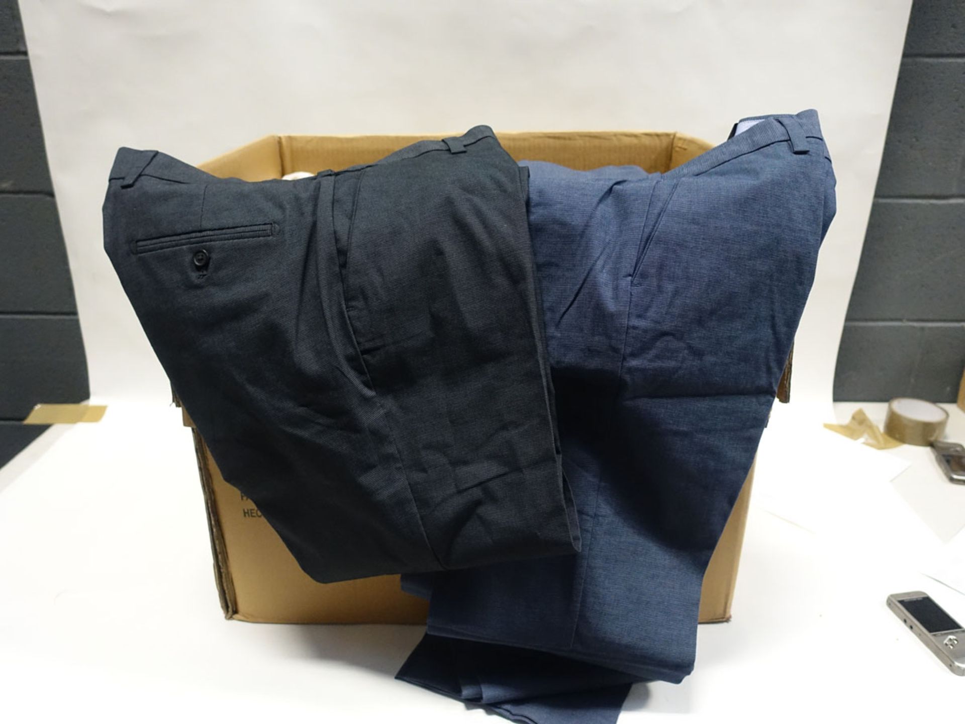 Box containing 36 pairs of gents trousers by Kirkland in blue and black (various sizes)