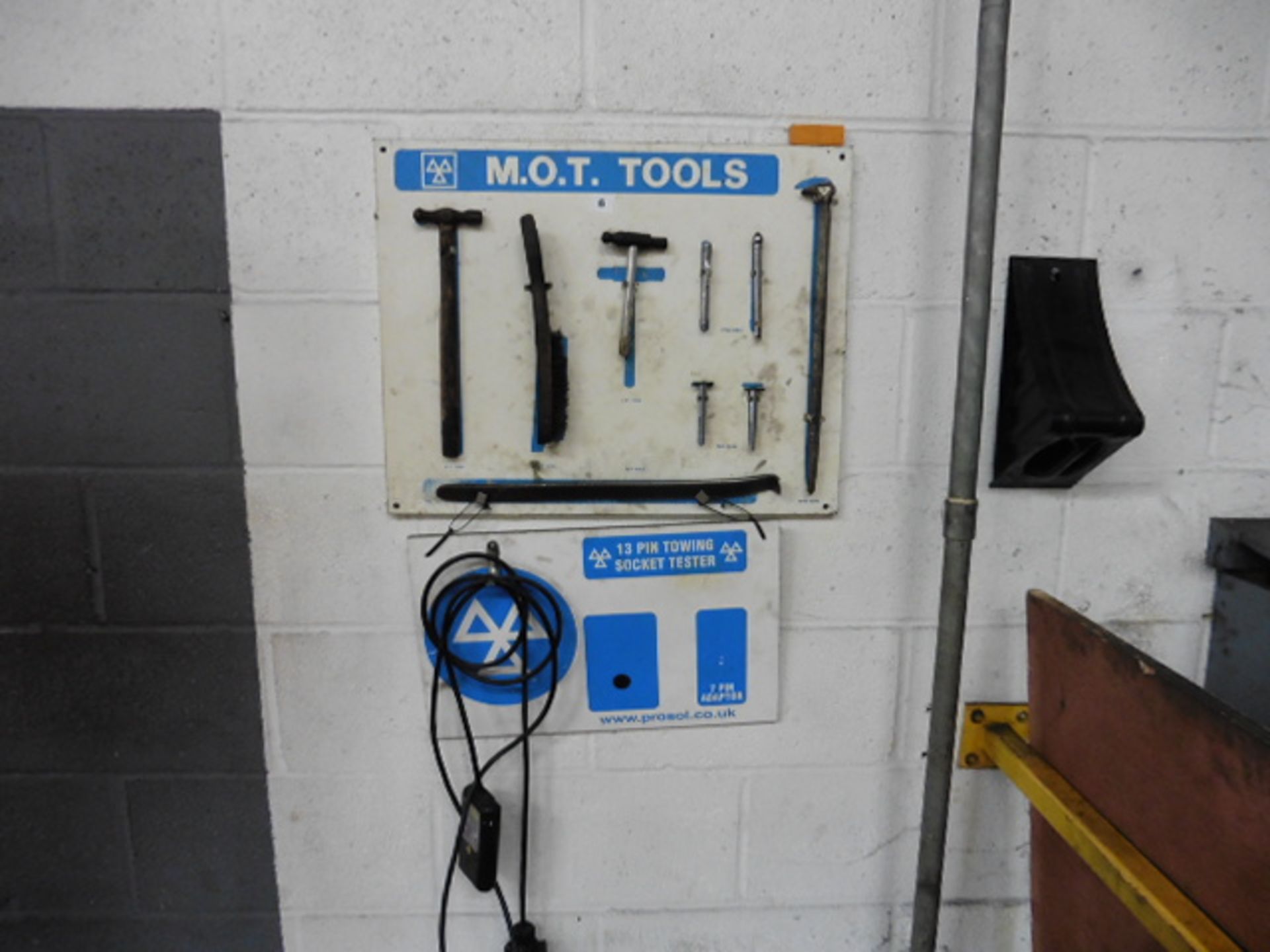 MOT Tools rack with contents and a towing socket tester