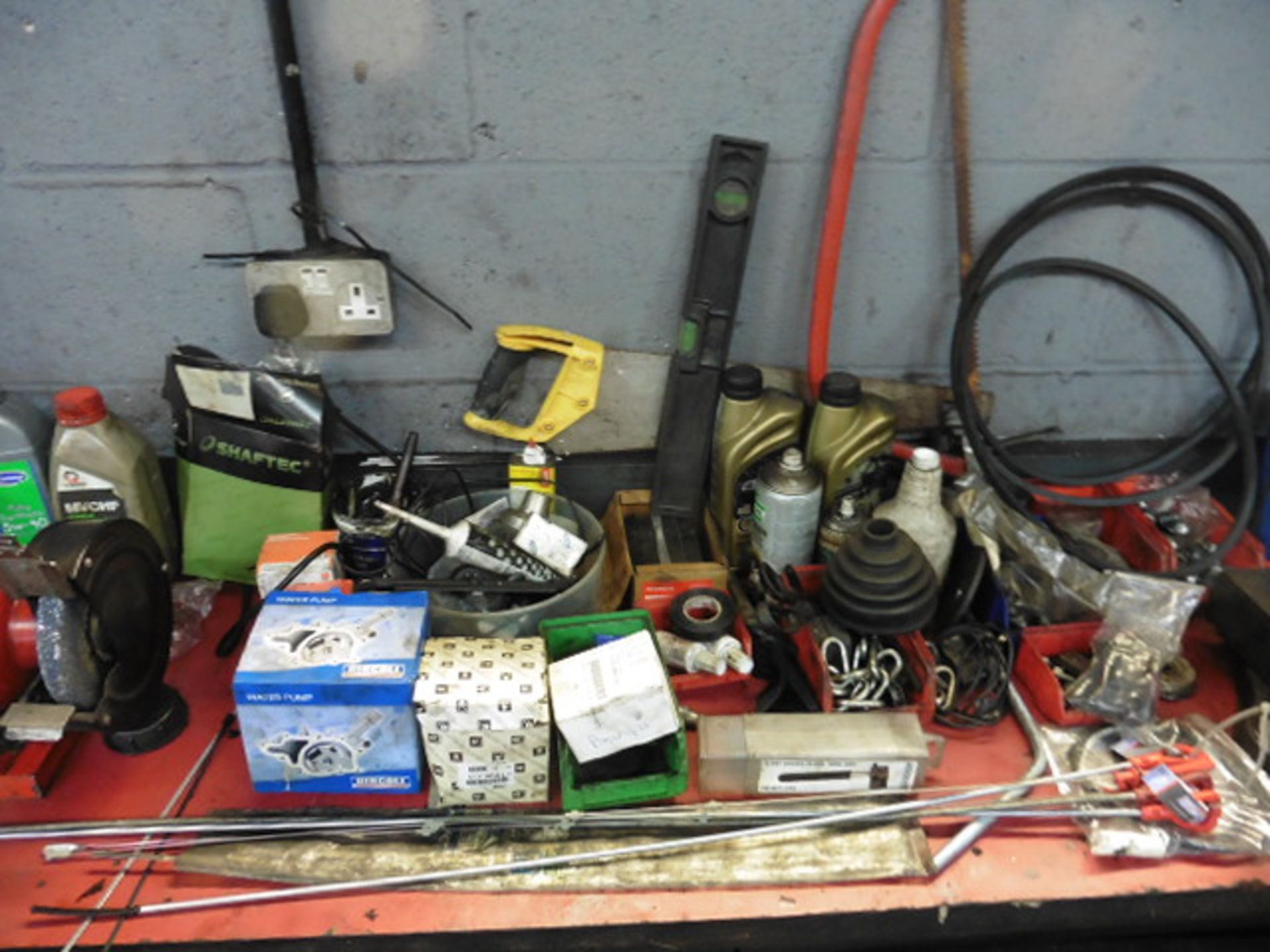 The remaining loose items on the work bench including parts, bulbs, washers ,lubricants, lin bins, - Image 2 of 4