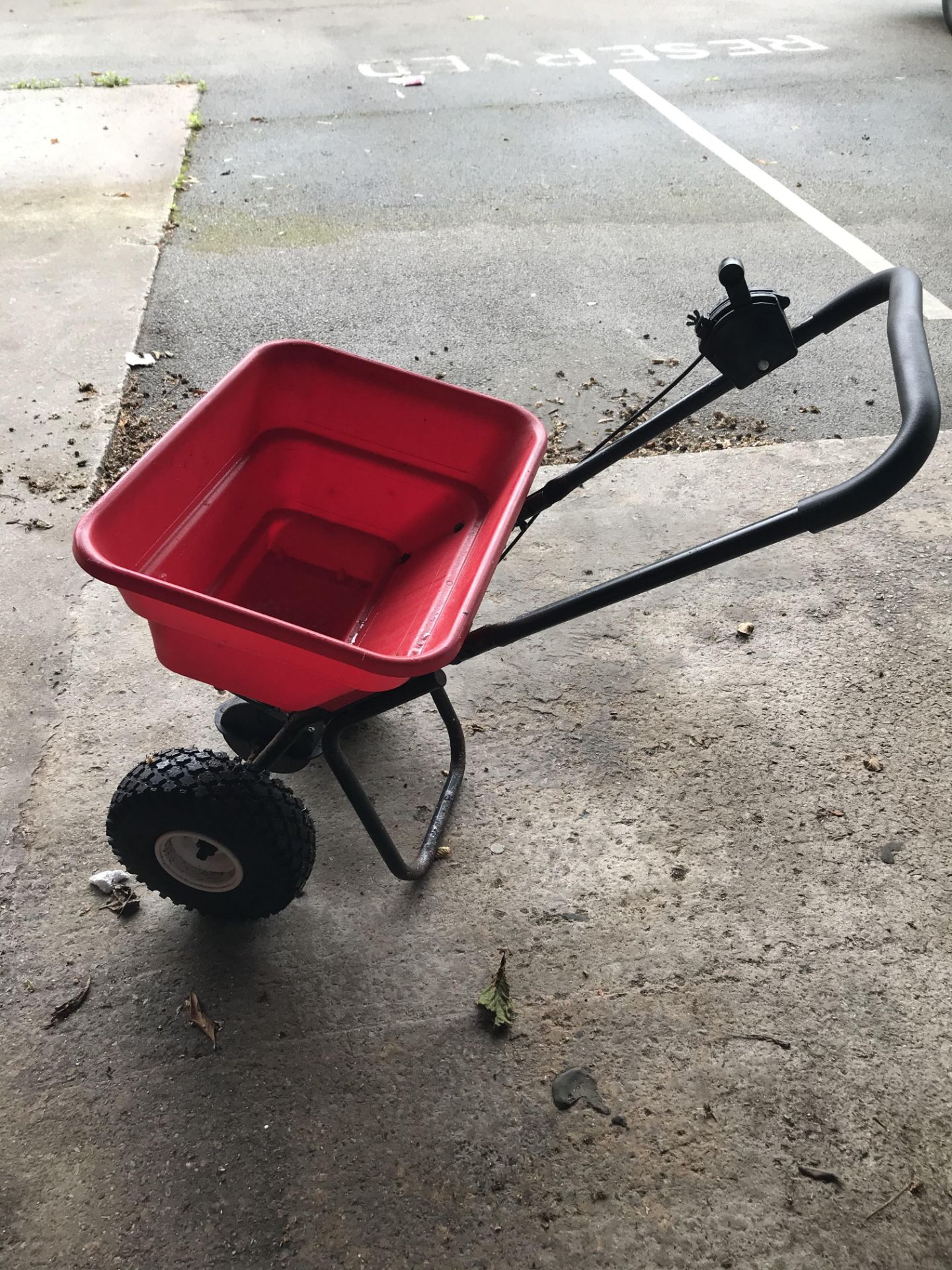 An Earthway EV-N-SPRED Push Along Spreader.