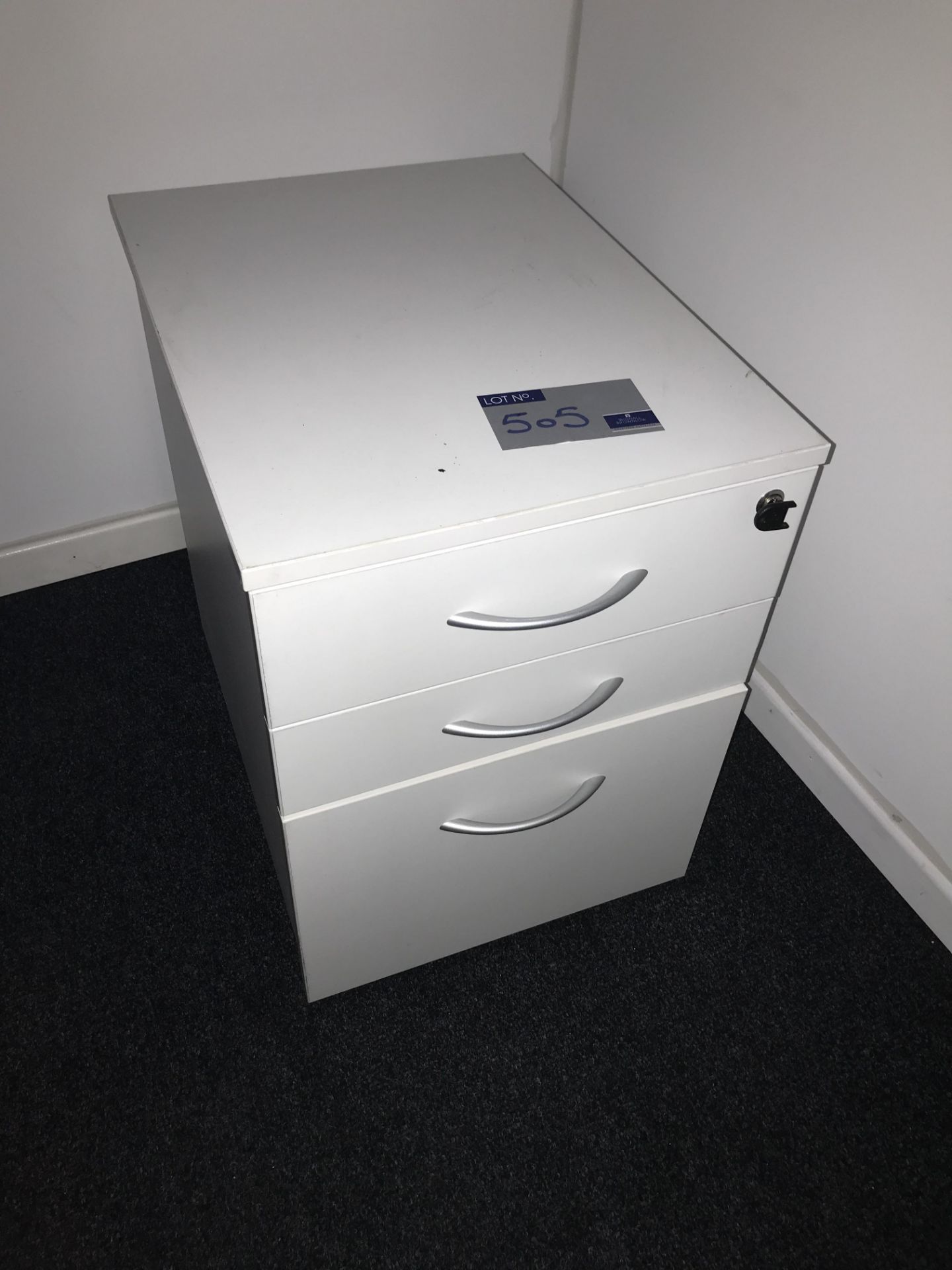 A White Melamine Veneer 3 drawer Filing Pedestal, 1200mm x 1600mm x 720mm.