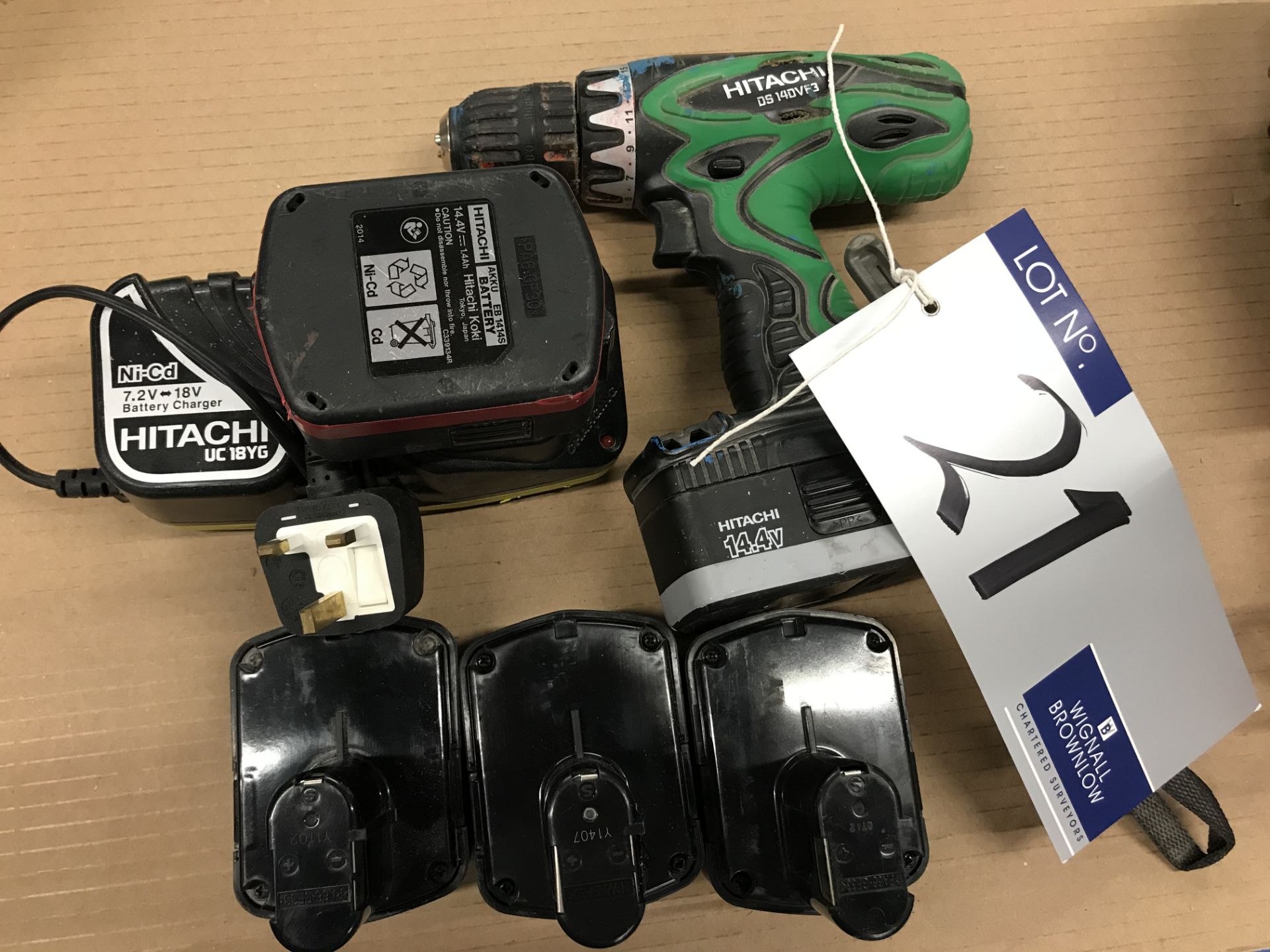 A Hitachi DS14DVF3 14.4v Cordless Drill with charger and five batteries.