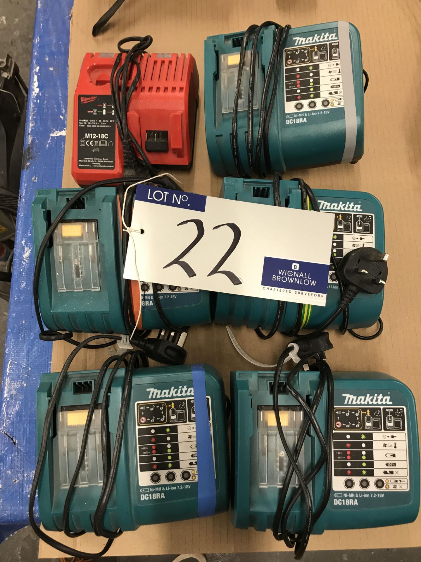 Six Power Tool 18v Battery Chargers: 5 Makita DC18RA and A Milwaukee M12-18C.