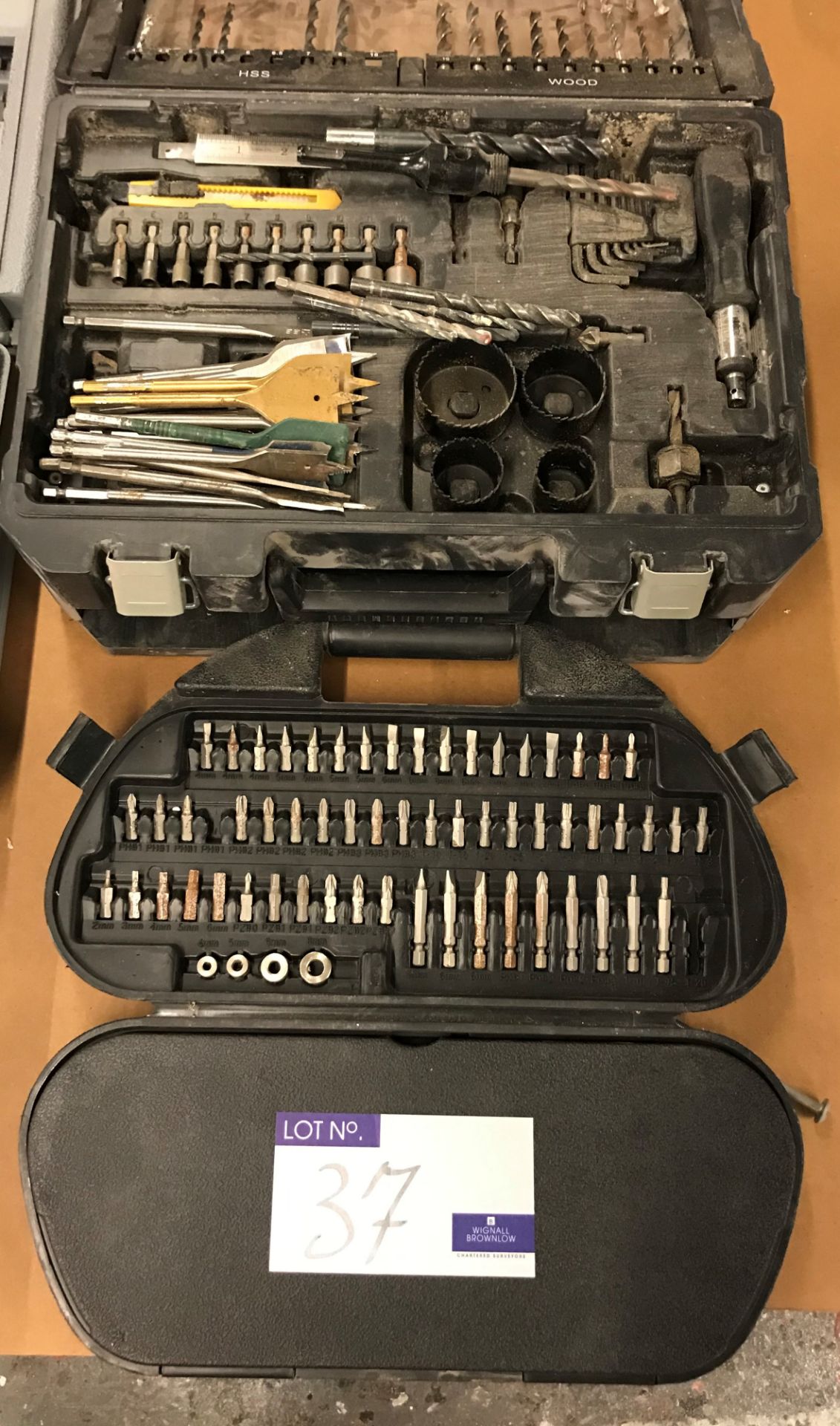 A Quantity of Drills, Hole Drills, and Driver Bits in 3 cases.