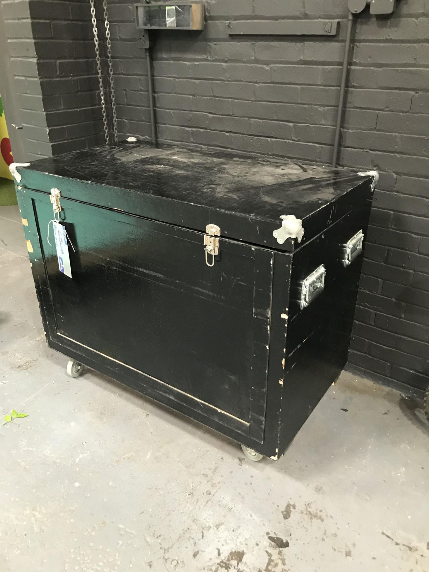 A Mobile Wooden Chest with Hinged Lid and Sliding Front, 48in x 26in x 40in h.