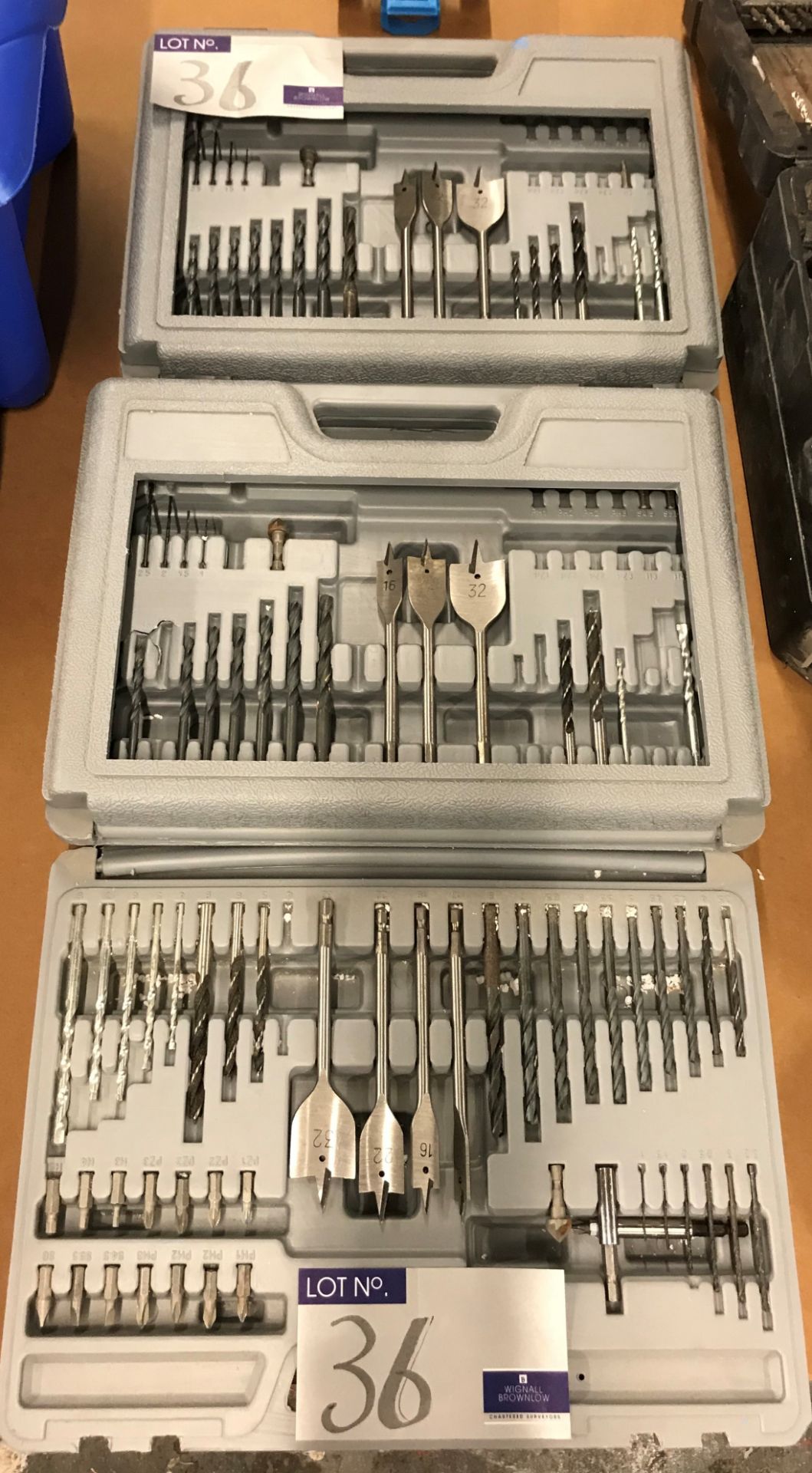 A Quantity of Drills, Hole Drills, and Driver Bits in 3 cases.