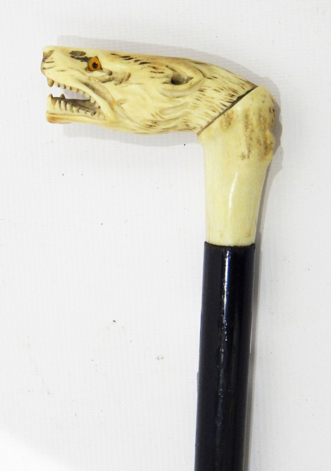 Bone handled walking stick with carved lion handle