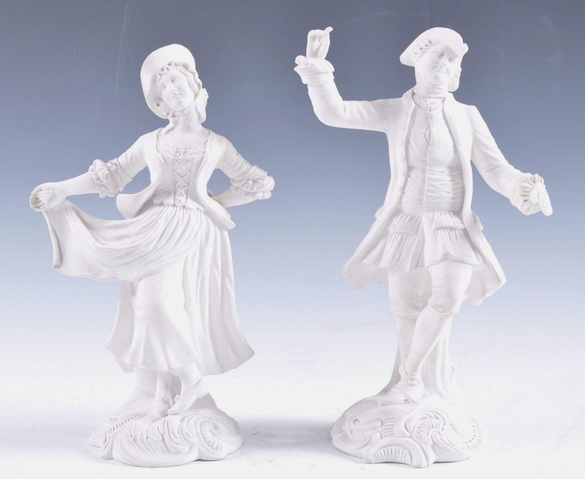 A pair of C18th biscuit figures probably Derby