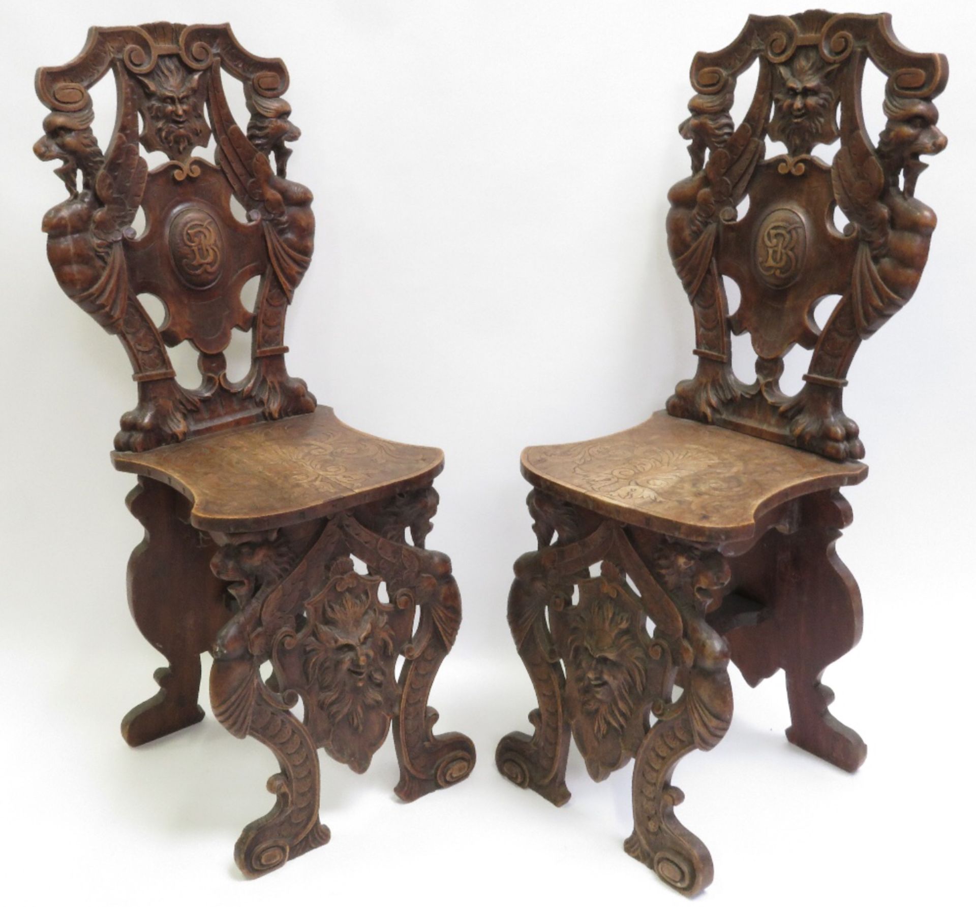 Pair of antique Italian walnut scabello chairs