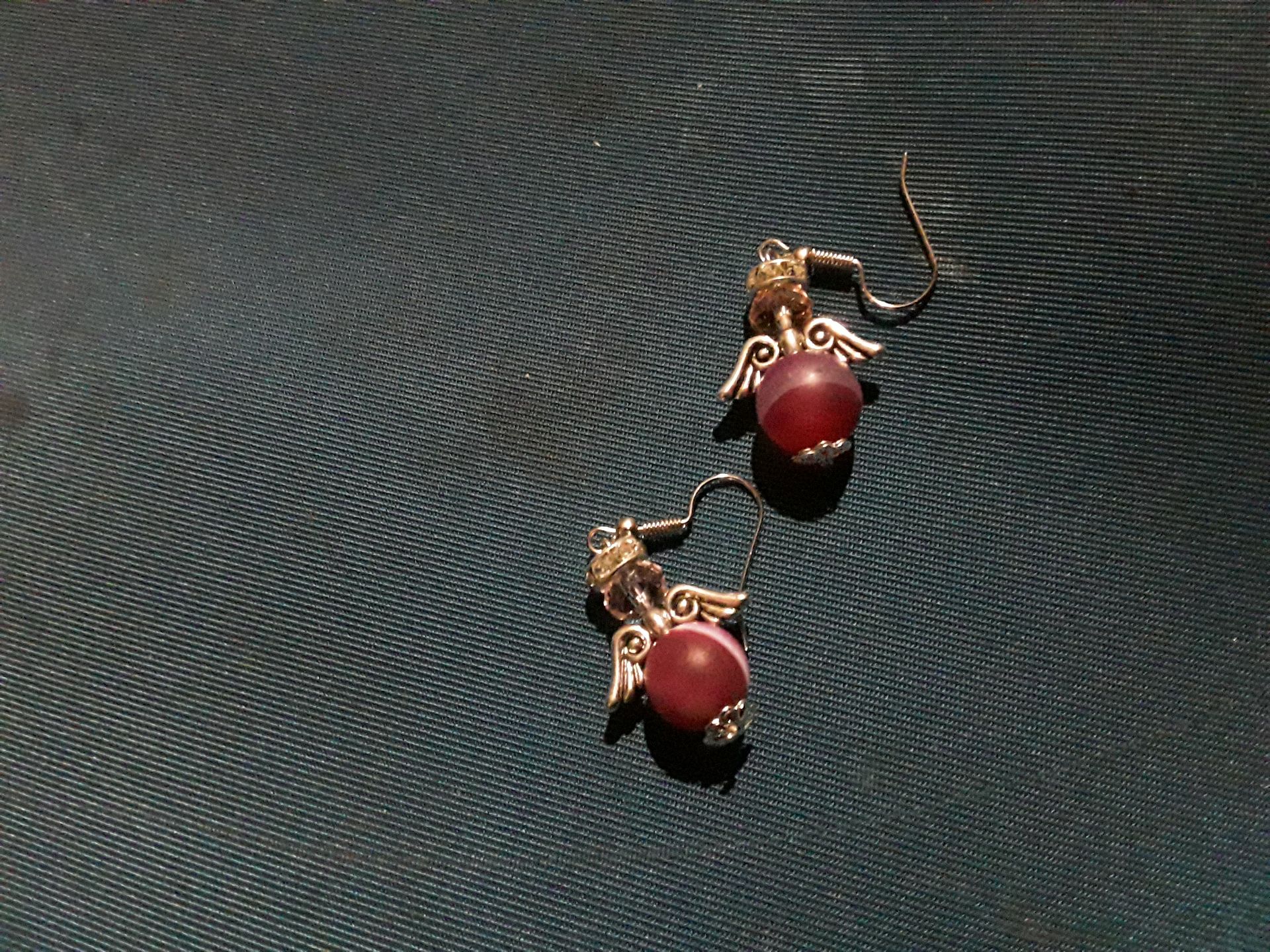 Women earrings with purple stone