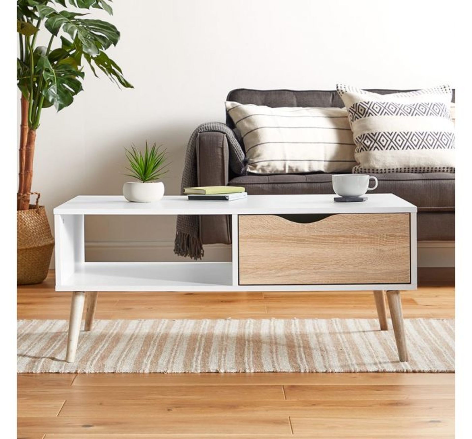 (QP27) White & Oak Coffee Table Split front features an open shelf on one side and a drawer on... (