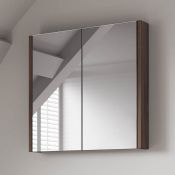 (XL163) 600mm Walnut Effect Double Door Mirror Cabinet. Finished in a stylish Walnut effect for...