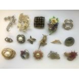 A group of various vintage costume jewellery brooches