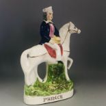 An antique Staffordshire right facing Flat Back man on horseback titled PRINCE