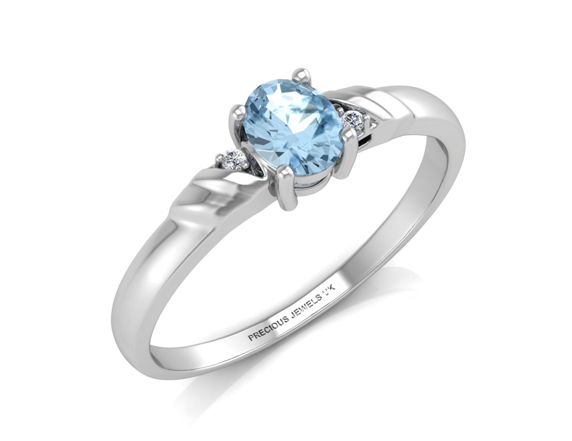 9ct White Gold Diamond And Blue Topaz Ring 0.01