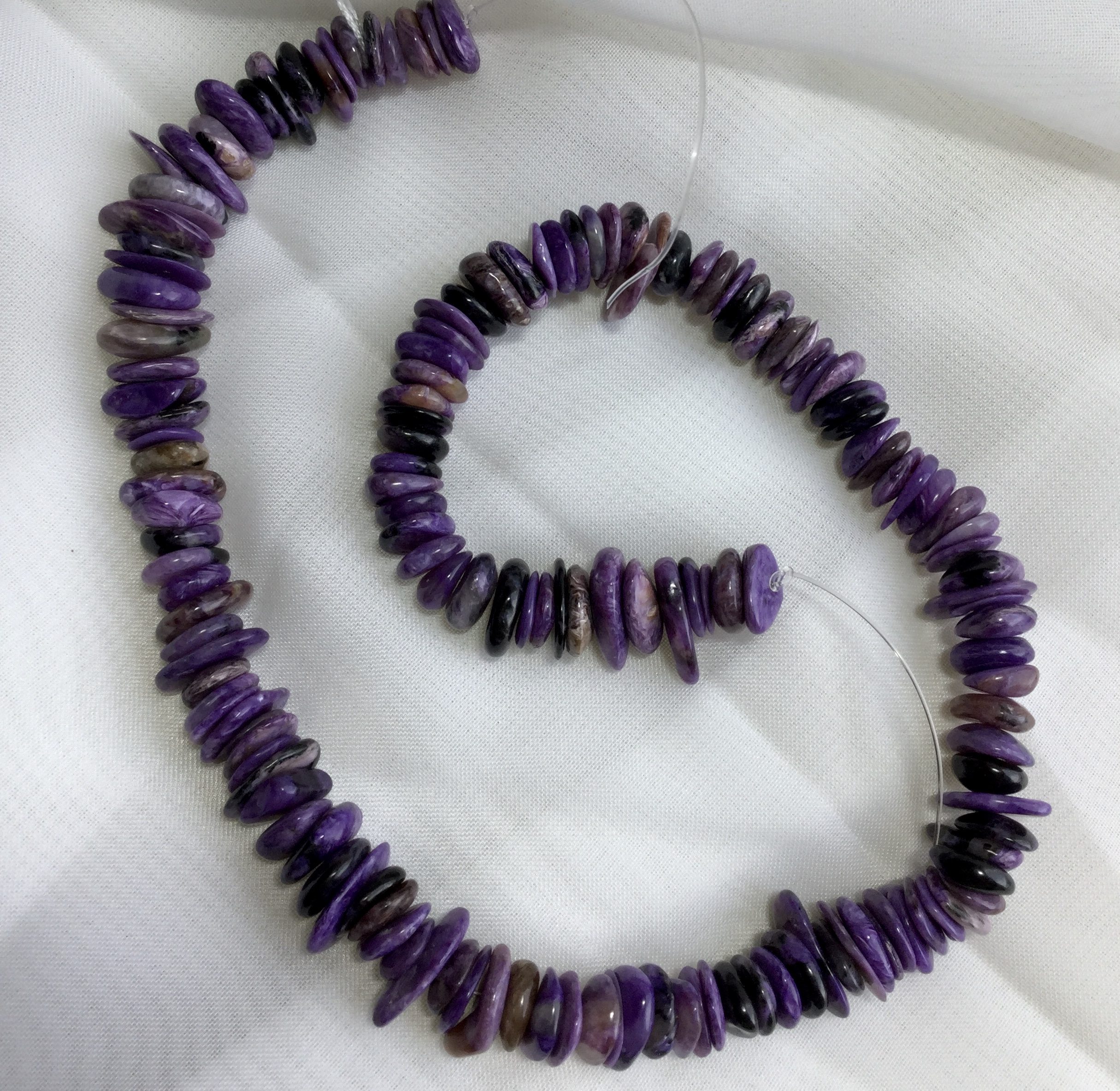 Charoite 300 cts Drilled tumbled slices 38 Cm long