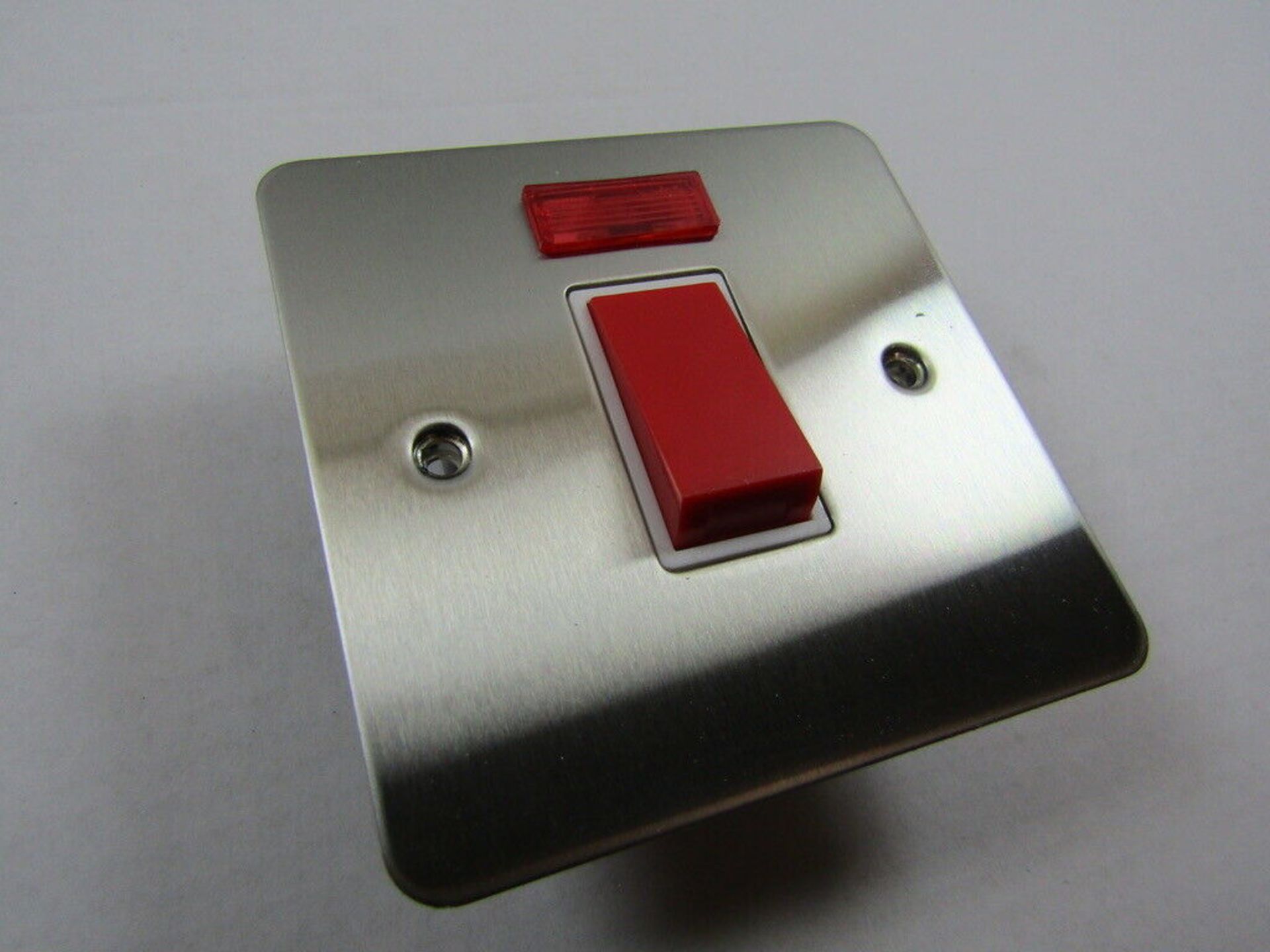 12 x 45 amp DP Cooker Switch. Neon. Satin Chrome. no vat on hammer.You will get 12 of these.45