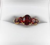 GOLD 5 STONE GARNET RING