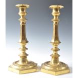 C19th pair of gilded brass candlesticks