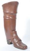 An oversized leather clad Georgian style boot, of modern construction