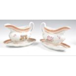 Pair of Samson engraved gravy boats and stands