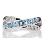 9ct White Gold Blue Topaz And Diamond Ring 0.06 Carats