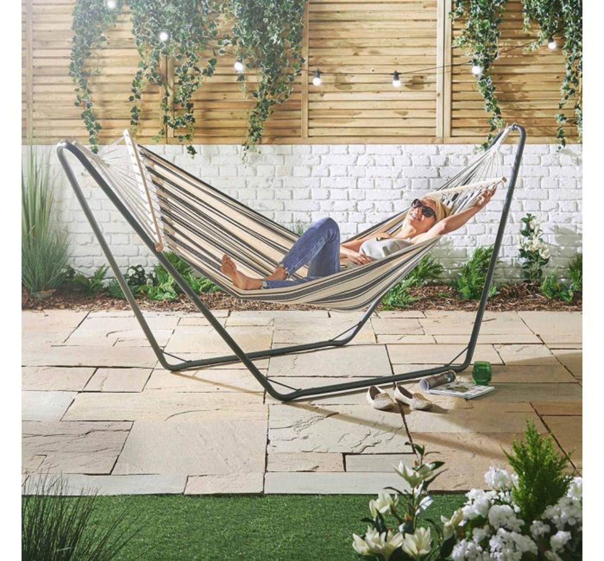 (D18) Single Hammock with Black Frame Bring the beach to your back garden with this coastal in...