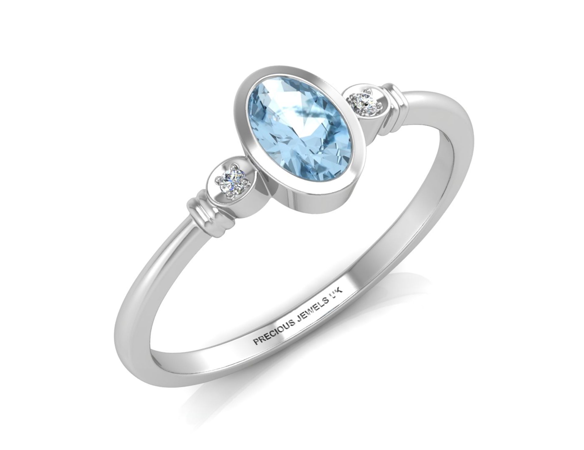 9ct White Gold Diamond And Oval Shape Blue Topaz Ring 0.01 Carats