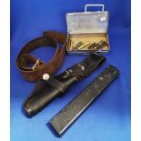 Group of military items. Pistol belt, holster, magazine, training rounds.