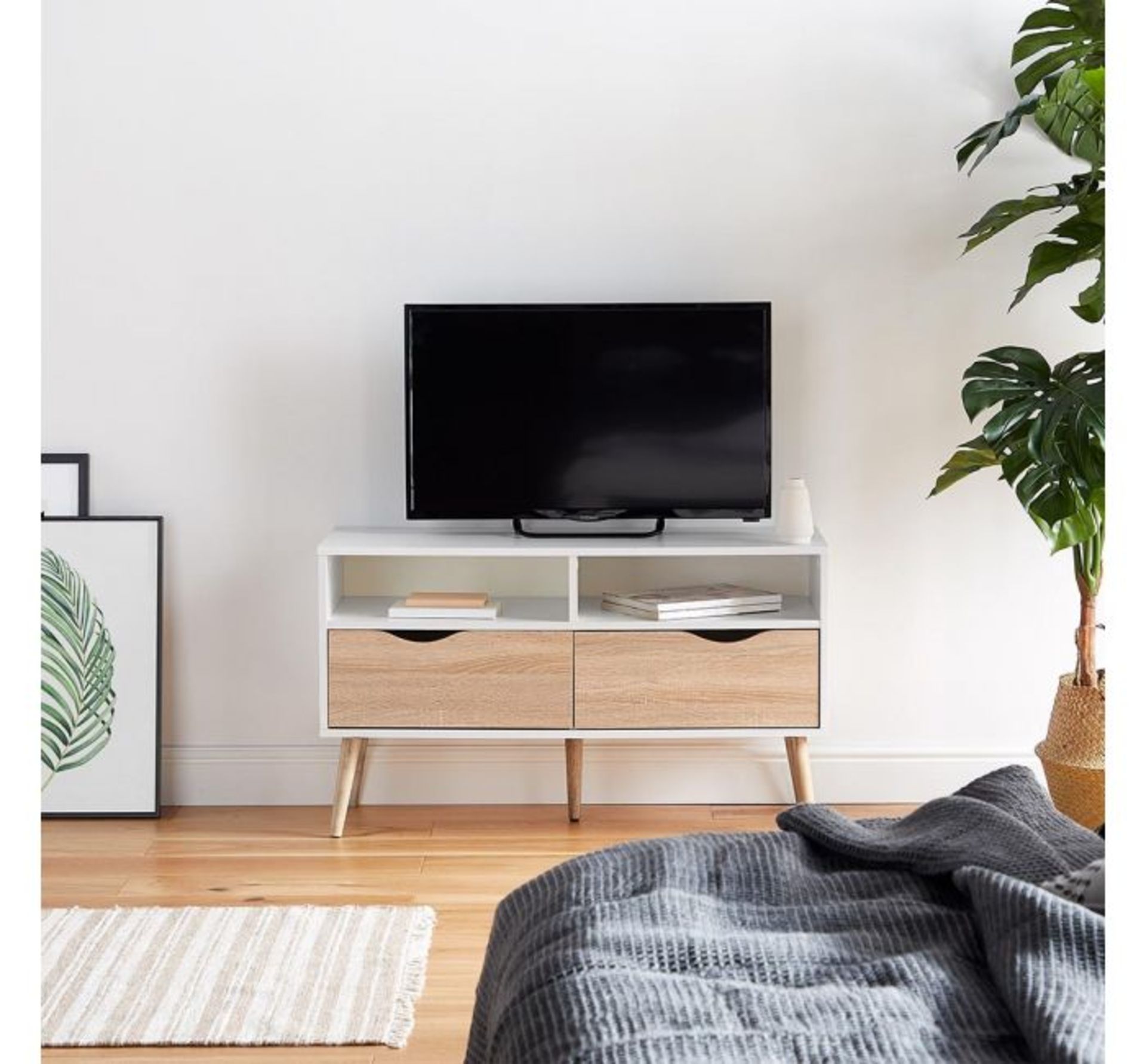 (AP165) White & Oak Small TV Unit Split front features a 2 shelves and 2 drawers Raised on on...