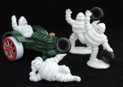 3 Small Cast Metal Michelin Men And 1 Michelin Figure On Tractor