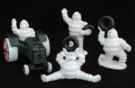 3 Small Cast Metal Michelin Men And 1 Michelin Figure On Tractor