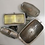 Four classic car fog lamps various conditions.
