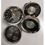 Group of four classic car Smiths guages including speedometer.