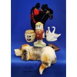 Group of novelty items including lazy dog, Barney Rubble, Welsh lady honey pot.