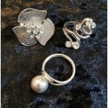 Group lot of white metal dress rings