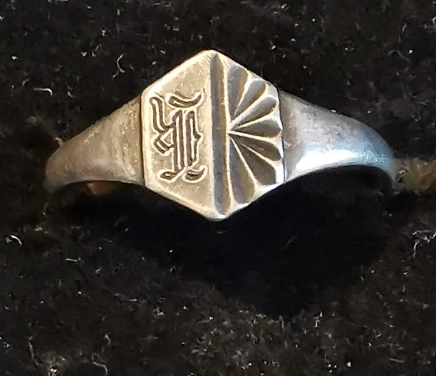 Small ring possibly childs signet ring, marked siver.