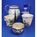 Group of hand thrown pottery items.