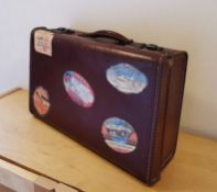 Small Vintage Travel Case Suitcase, with vintage Hotel Travel labels stage prop shop display